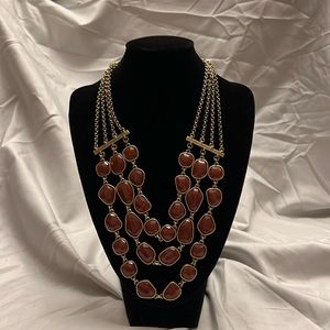 Gold and brown necklace.